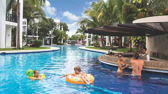 Family enjoy the all inclusive resort with infinity pools | The Fives Azul Beach | Playa del Carmen