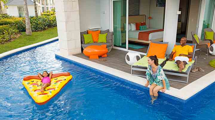 Exciting family suite with child on kiddie float at nickelodeon resort in Punta Cana, Dominican Republic | Karisma Hotels & Resorts®