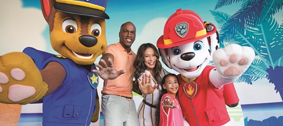 Family enjoying taking photos with paw patrol characters at nickelodeon all inclusive resort in punta cana dominican republic