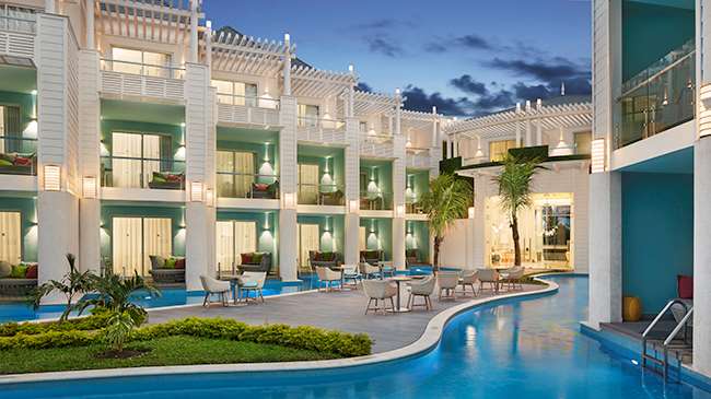 Elegant evening view of rooms and suites at azul beach resort negril jamaica