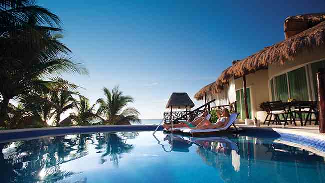 Couple relaxing at a Presidential Suite in all inclusive resort | El Dorado Casitas | Riviera Maya