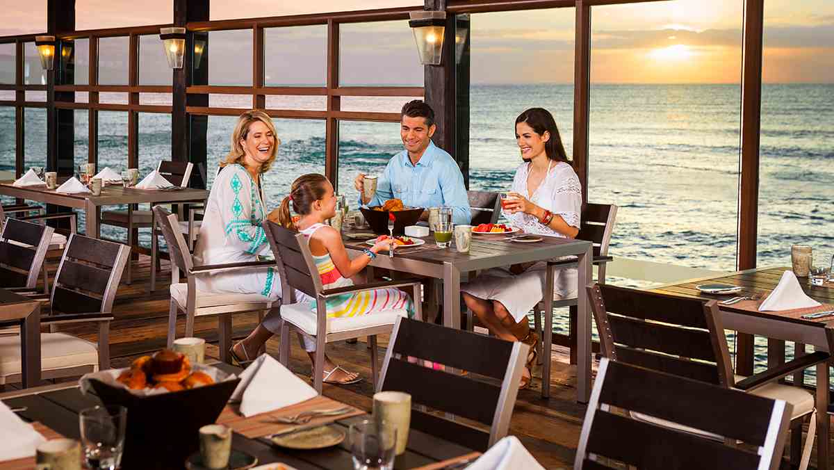 Sunset dining with family over the ocean at Generations Riviera Maya in Cancun