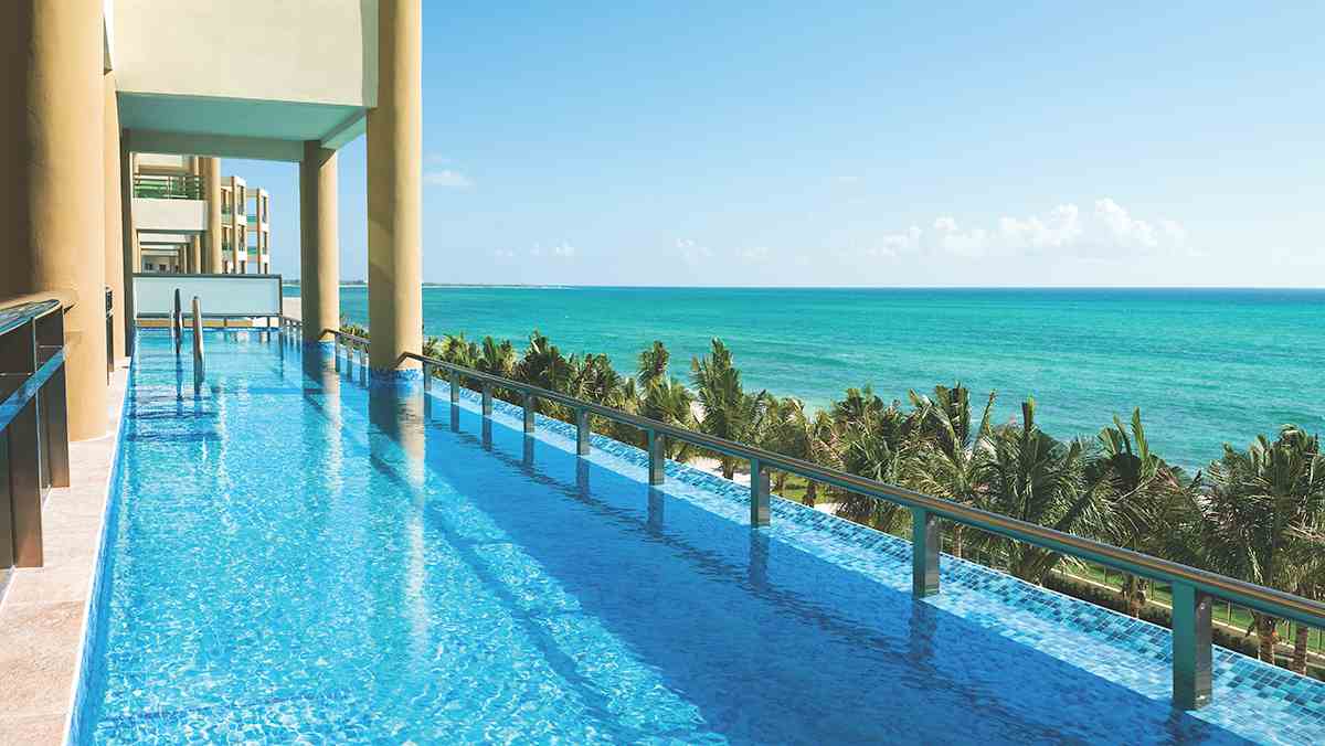 Breathtaking oceanfront view with infinity pool at Generations Riviera Maya in Cancun